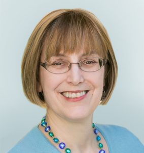 Headshot of Lori Friedman, PHD Chief Scientific Officer on light sage background