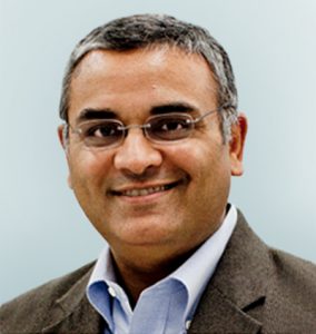 Headshot of Pratik Multani, MD Chief Medical Officer on light sage background